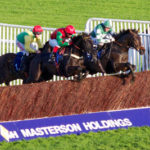 Horses Jumping Fence at Cheltenham